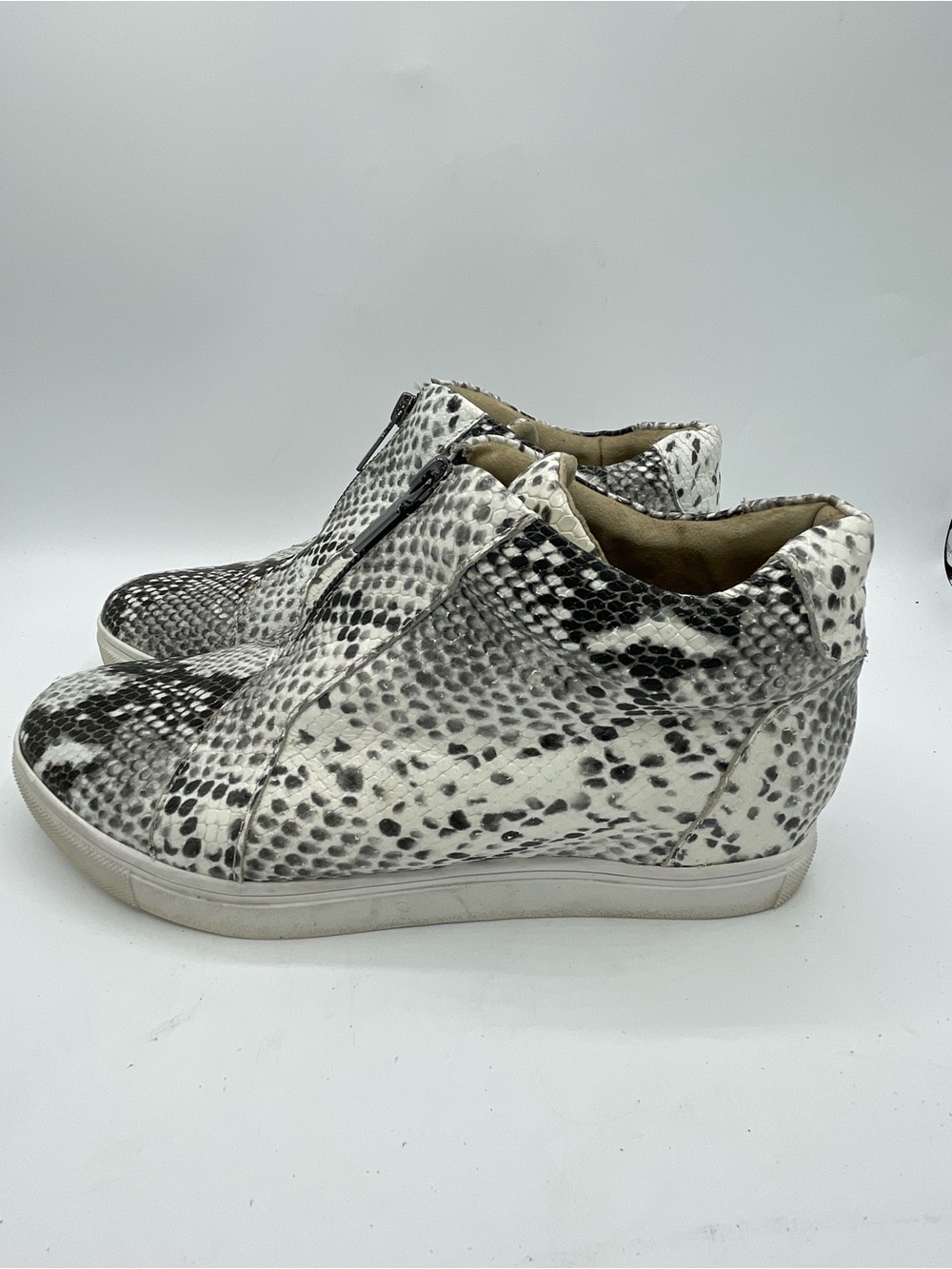 Blondo Glenda Black & White Snakeskin Zip Wedge Sneaker.